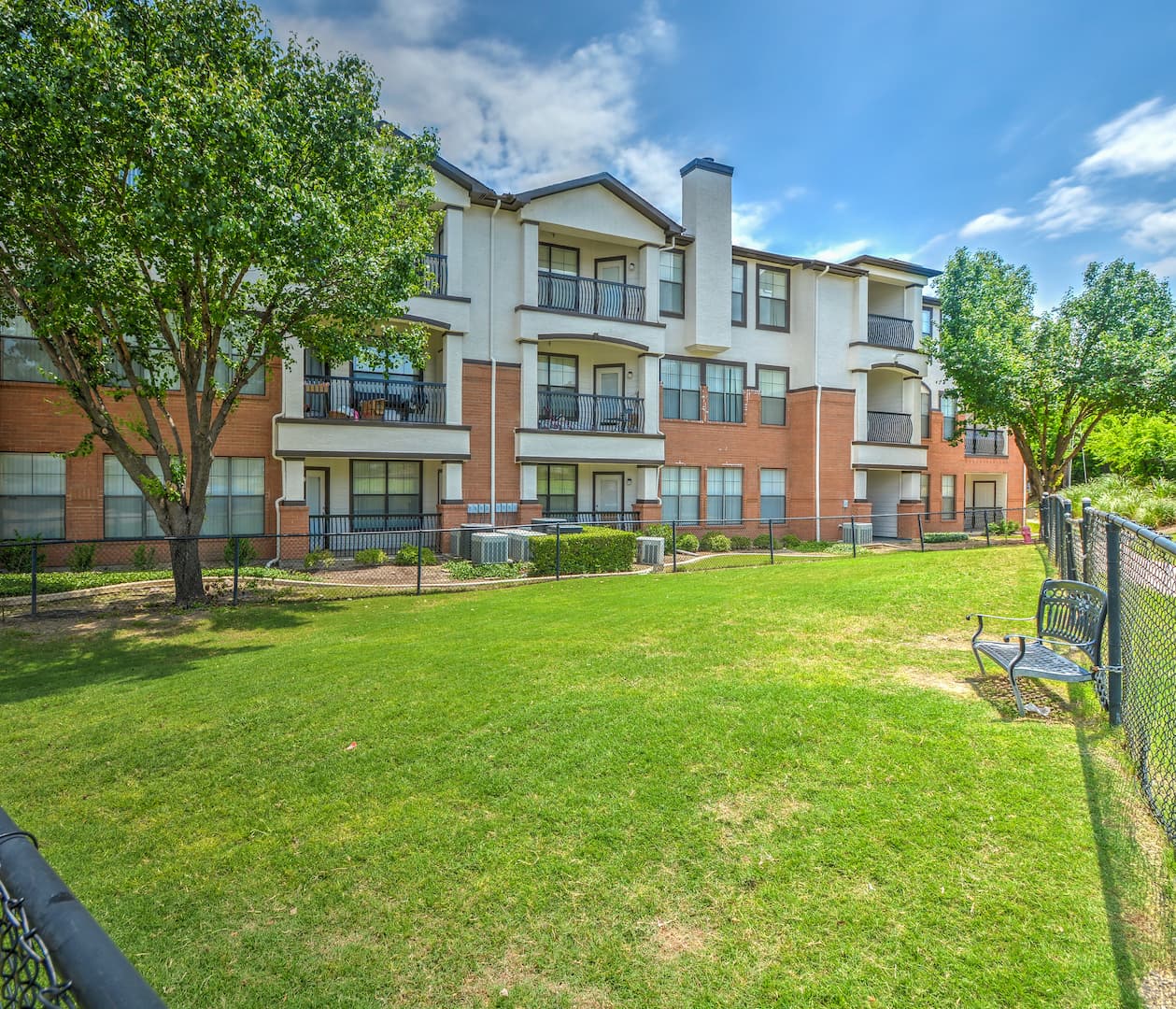 exterior view of apartment building and bark park