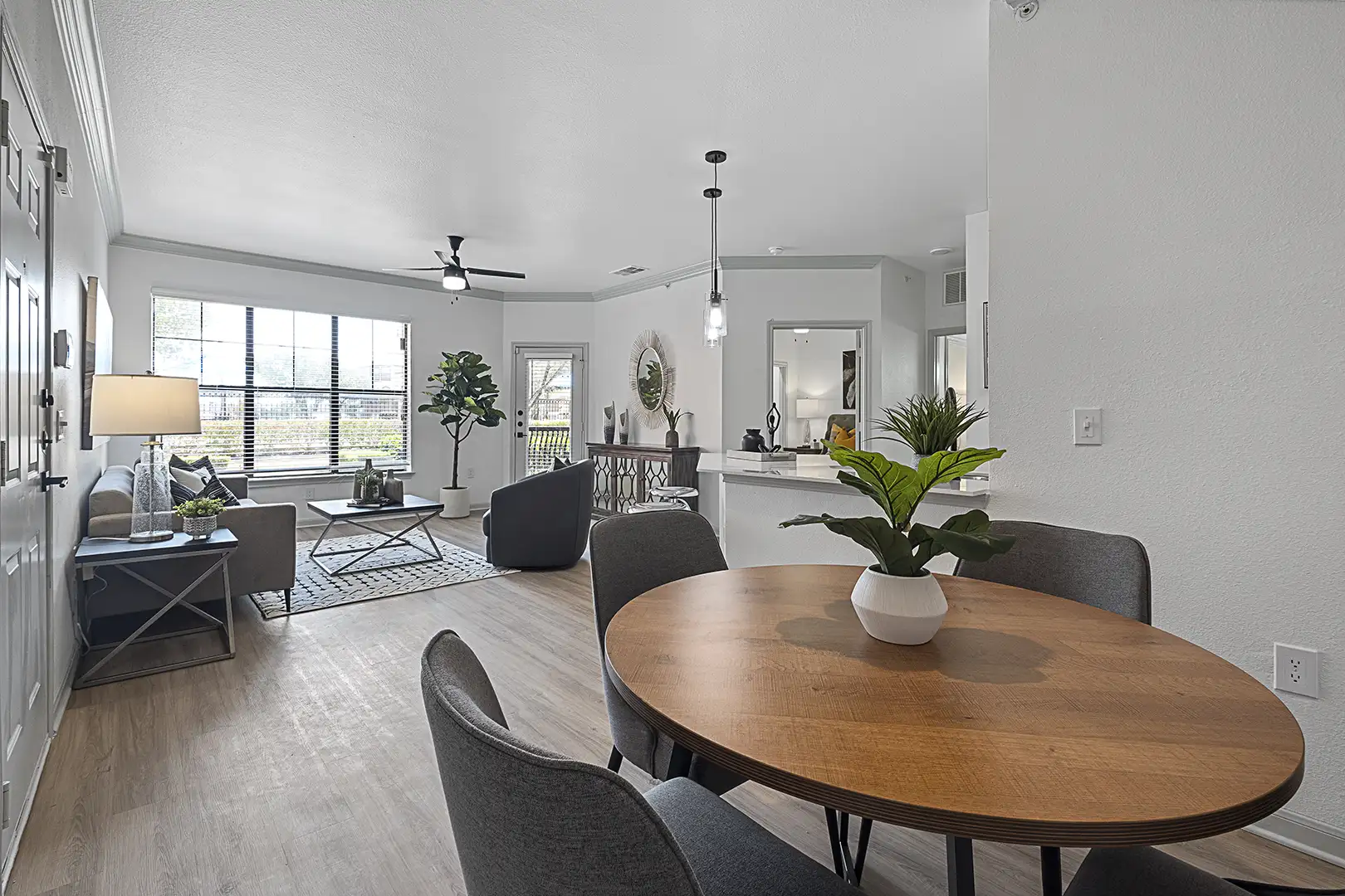 dining room and living room with modern furniture looking towards window, patio and bedroom