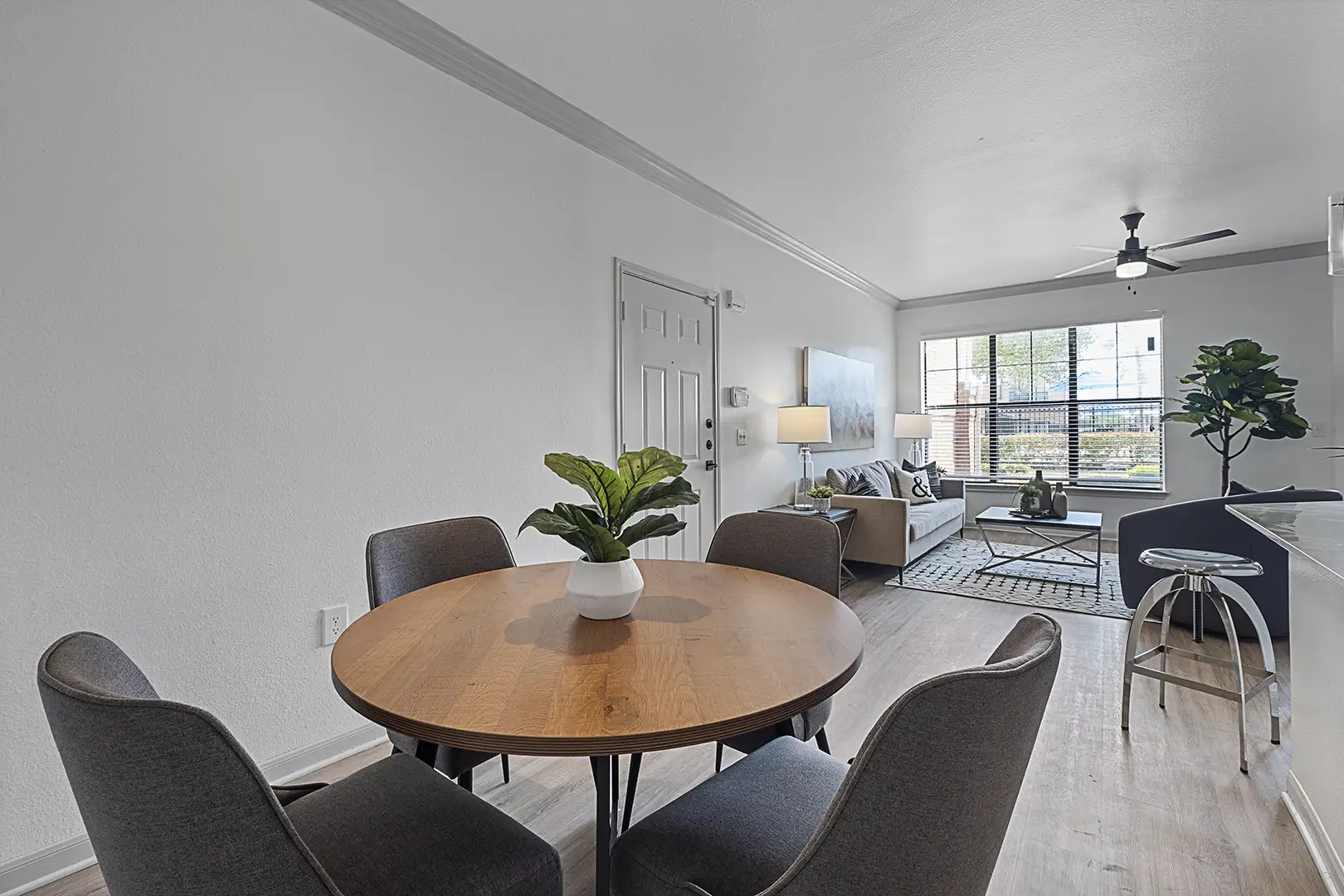 dining room and living room with modern furniture looking towards window